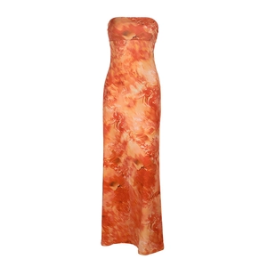 Detail of slim fit strapless maxi dress with orange abstract art print for summer