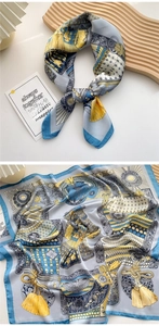 Detail of silk square scarf featuring vintage European knot and chain patterns in blue and yellow
