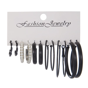 6-pair set of black C-shaped hoop earrings and elegant pearl studs on a display card