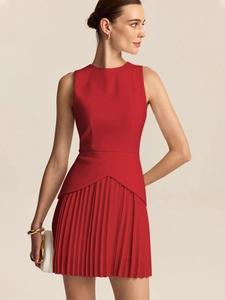 Elegant red sleeveless pleated dress with geometric waist detailing and smooth woven fabric