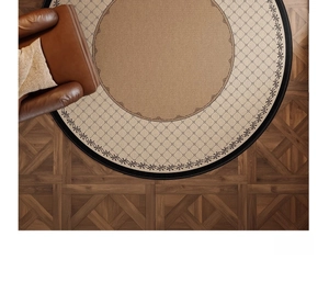 Detailed top view of retro round rug with geometric patterns on vintage wood floor