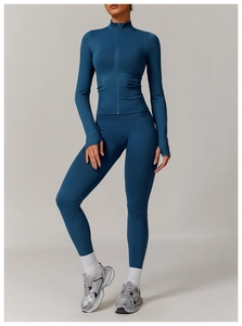 Detail of dark blue seamless yoga jacket with thumbholes and stand-up collar design