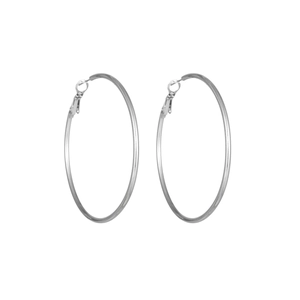 Macro shot of large polished silver hoop earrings showing smooth texture and clasp details