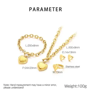 Detail of gold stainless steel jewelry set featuring heart charms and OT buckle chains