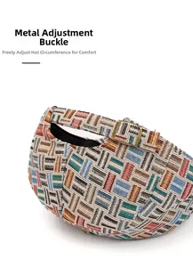 Detail of adjustable metal buckle on colorful geometric jacquard woven newsboy hat