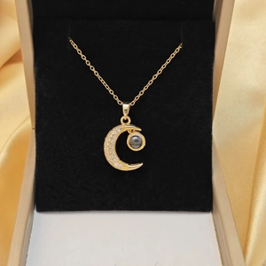Golden moon pendant necklace with double heart layers and black projection stone