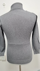 Detail view of the gray turtleneck knit sweater showing back texture and slim fit design
