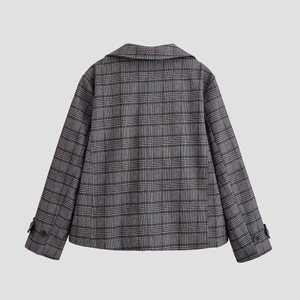 Back view of stylish black and white plaid women's blazer with lapels and long sleeves