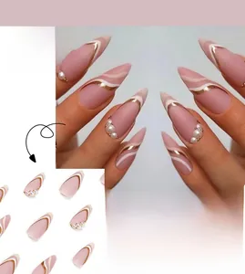 French press-on nails with matte nude pink, gold waves, and pearl accents