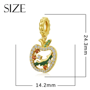 Golden hollow apple pendant with crystals and green enamel leaf, 24.3mm height