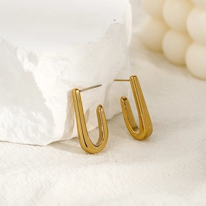 Polished 18K gold stainless steel U-shape hoop earrings on a minimalist white backdrop