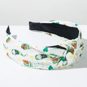 Close-up of St. Patrick's Day knotted headband with leprechaun and shamrock patterns