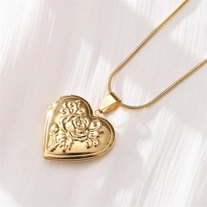 Golden heart-shaped locket necklace with rose carving on a sleek snake chain