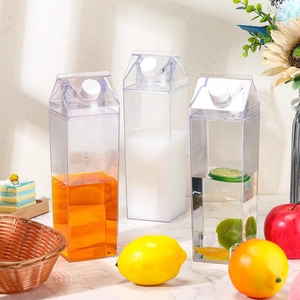 Three clear 1000ml square milk box water bottles with fruit slices on marble surface