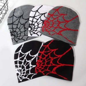 Detailed flat lay of five different colored Y2K spider web jacquard knitted beanies