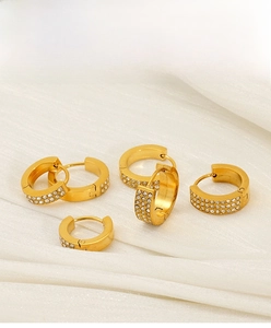 Detailed view of luxury gold-plated stainless steel hoop earrings with micro-set zircons