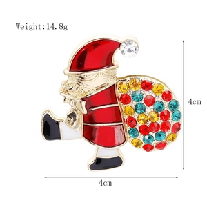 Detailed view of Santa Claus brooch with red enamel and rhinestones measuring 4cm by 4cm