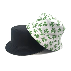 Reversible clover print bucket hat for sun protection in black and white styles