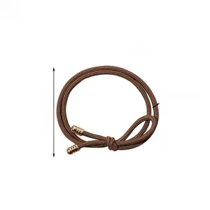 Detail of dark brown braided hair tie with gold cylindrical ends and size measurements