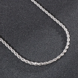 Macro shot of silver twisted rope chain detail showing classic stainless steel texture