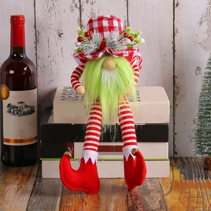 Christmas gnome doll with long green beard and plaid hat as festive home decor