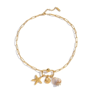 Detailed view of 18K gold-plated paperclip chain with starfish and seashell charms