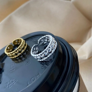 Minimalist S925 sterling silver hollow beaded open ring shown on a black textured surface