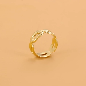 Detailed close-up of golden stainless steel ring featuring unique interlocking chain link design