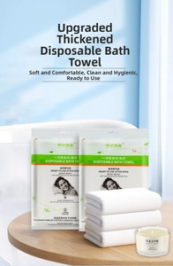 Detail of disposable white cotton towel set with thick honeycomb texture in bathroom