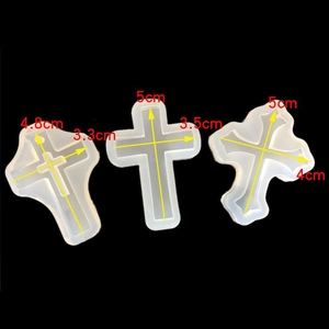 Three assorted cross-shaped silicone resin molds with precise size measurements