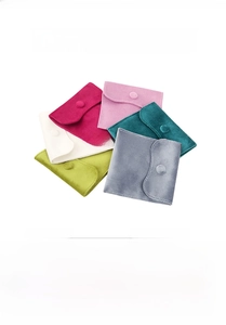 Detailed display of snap button velvet jewelry pouches in six assorted elegant colors