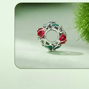 Macro view of S925 silver ladybug bead with red enamel and white zircon settings