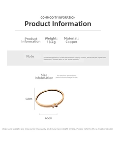 Detail view of 18K gold plated oval bangle with pavé micro-inlaid zircon letter pendant