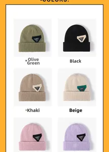 Detail view of 6 colorful ribbed knit beanies with triangle happy letter patches