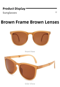 Detail view of foldable tea-colored sunglasses with transparent frames and side hinges
