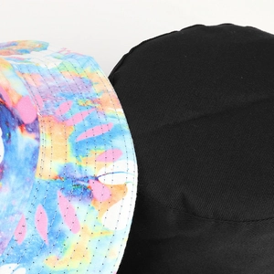 Reversible tie-dye bucket hat with colorful butterfly print and solid black cotton fabric