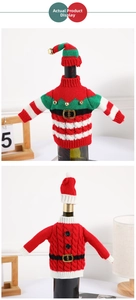 Detail of festive Christmas wine bottle covers with knitted mini sweaters and tiny bells