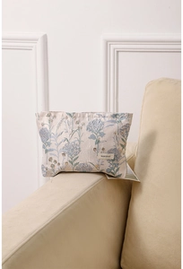Close-up of floral jacquard fabric and H&R BAG label on portable cosmetic organizer