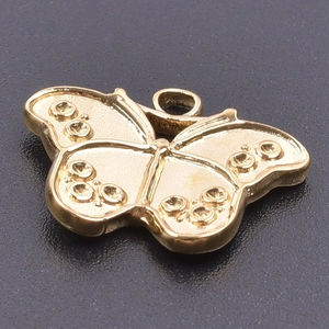 Close-up of golden stainless steel butterfly pendant with embossed texture and metal ring