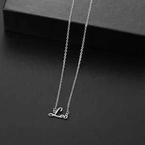 Leo constellation silver stainless steel pendant necklace on a minimalist dark background