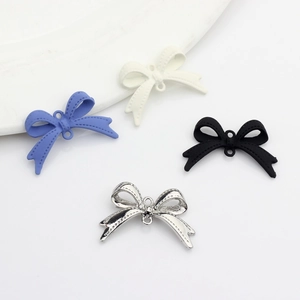 Solid color spray-painted alloy bow accessories for DIY jewelry in multiple colors