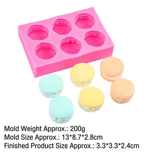 Detail view of 6-cavity macaron silicone mold with dimensions and colorful dessert samples
