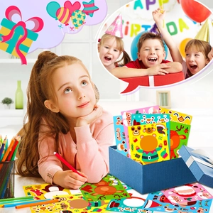 Detail view of children using DIY Christmas Santa Claus make-a-face puzzle sticker sheets