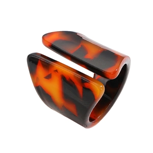 Detail of tortoiseshell resin ring featuring irregular wide band and leopard pattern
