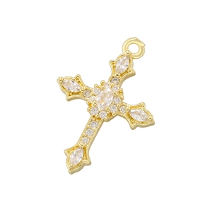 Macro shot of gold-plated cross pendant with clear cubic zirconia inlay details
