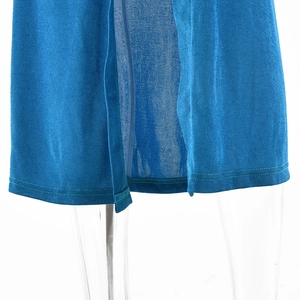 Detailed macro view of the blue knit dress hem featuring a hidden side zipper closure