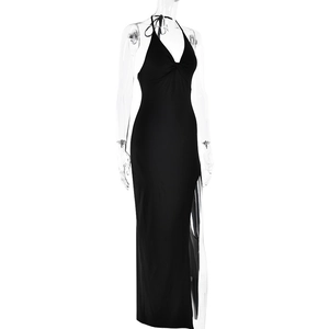 Detail view of the black halter backless maxi dress with a sexy high side slit design