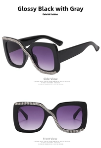 Close-up of square black sunglasses with crystal rhinestones and purple gradient lenses