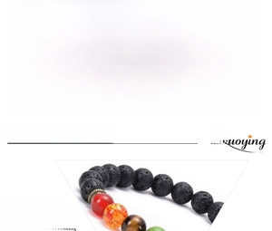 Macro detail of 8mm lava rock and turquoise beads with size specifications for yoga bracelet