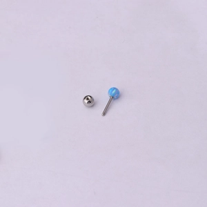 Blue opal stainless steel helix piercing stud with threaded ball back on grey background